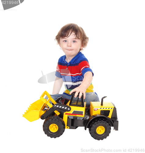 Image of Three year old boy with his toy.