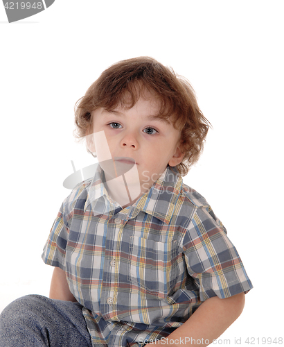 Image of Portrait of serious little boy.