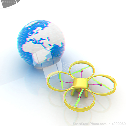 Image of Quadrocopter Drone with Earth Globe and remote controller on a w