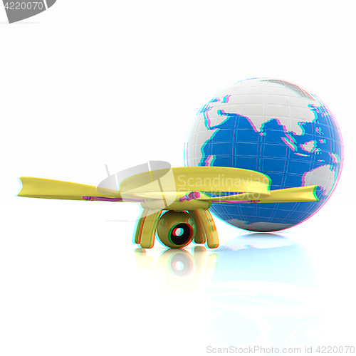 Image of Quadrocopter Drone with Earth Globe and remote controller on a w