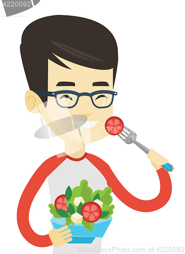 Image of Man eating healthy vegetable salad.
