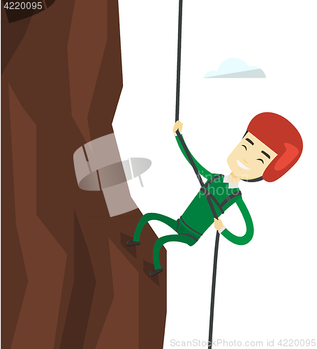 Image of Man climbing in mountains with rope.