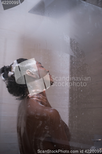 Image of African American woman in the shower