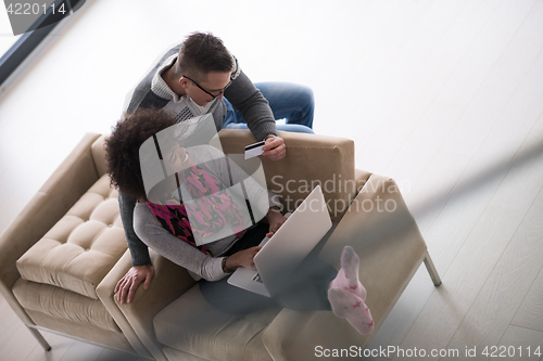 Image of multiethnic couple shopping online