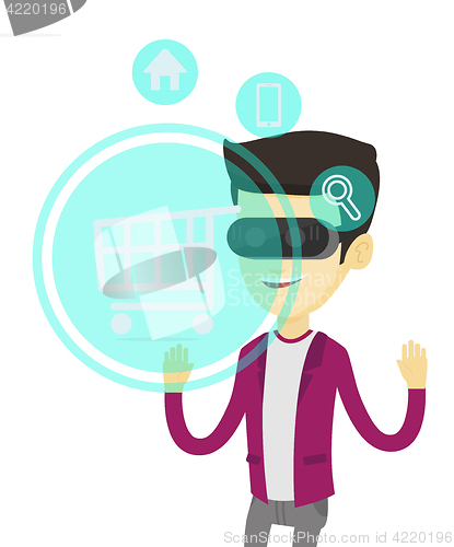 Image of Man in virtual reality headset shopping online.