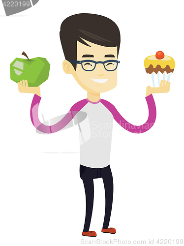 Image of Man choosing between apple and cupcake.