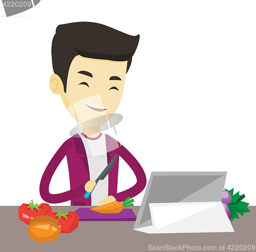 Image of Man cooking healthy vegetable salad.