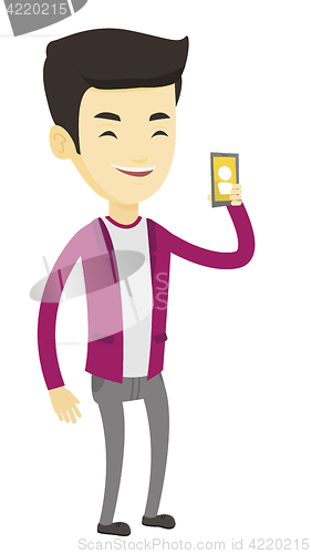 Image of Man holding ringing mobile phone.