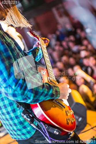 Image of The blur silhouette of rock musician at abstract rock concert