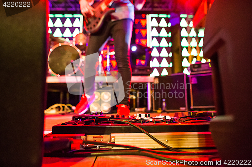 Image of The blur silhouette of rock musician at abstract rock concert