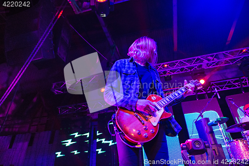 Image of The blur silhouette of rock musician at abstract rock concert