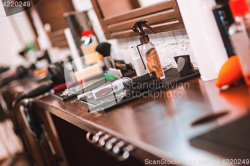 Image of Barber shop equipment on wooden background.