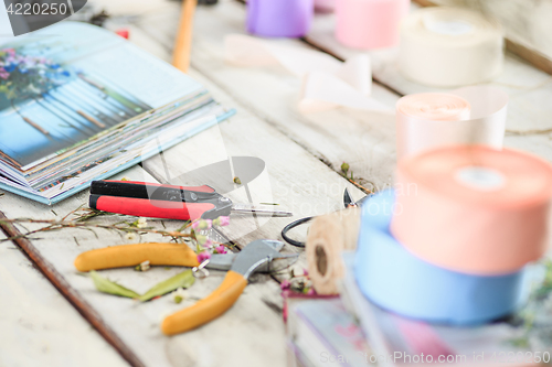 Image of The florist desktop with working tools on white background