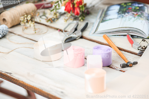 Image of The florist desktop with working tools on white background