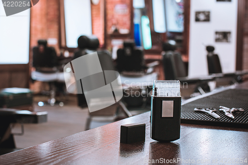 Image of Barber shop equipment on wooden background.