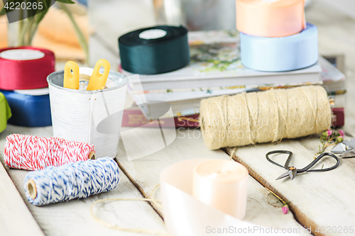 Image of The florist desktop with working tools on white background