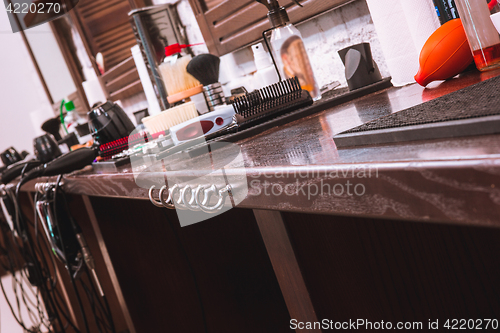 Image of Barber shop equipment on wooden background.