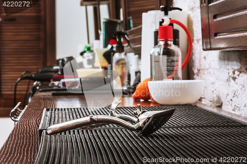 Image of Barber shop equipment on wooden background.