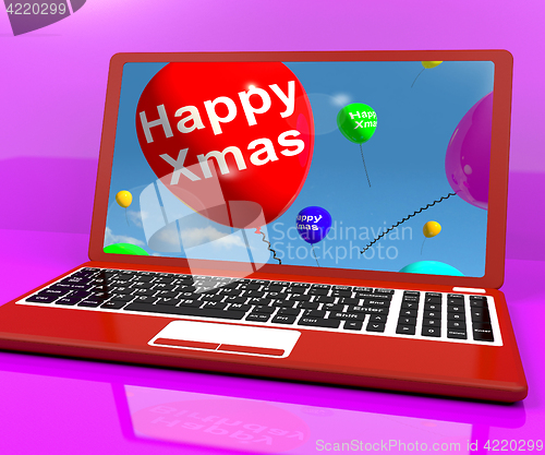 Image of Red Balloons With Happy Xmas On Computer For Online Greetings