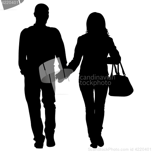 Image of Silhouette man and woman walking hand in hand