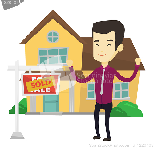 Image of Real estate agent with sold placard.