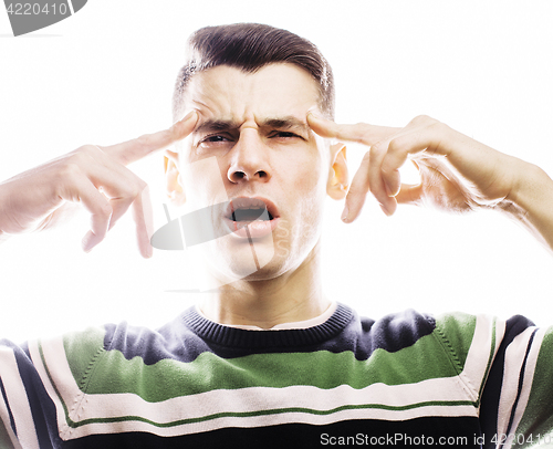 Image of Portrait of a smart serious young man standing against white background. Emotional concept for gesture 