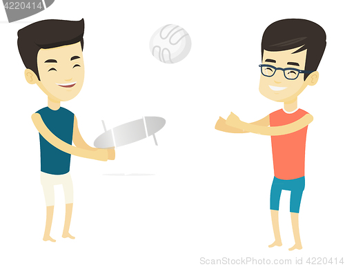 Image of Two men playing beach volleyball.
