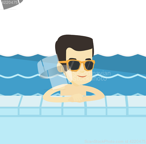 Image of Smiling young man in swimming pool.