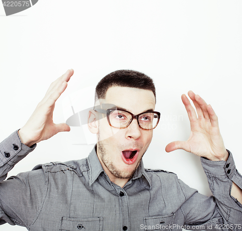 Image of young handsome well-groomed guy posing emotional on white background, lifestyle people concept