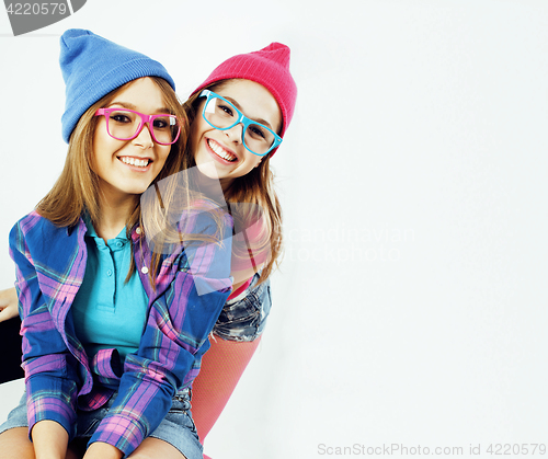 Image of lifestyle people concept: two pretty stylish modern hipster teen girl having fun together, happy smiling making selfie