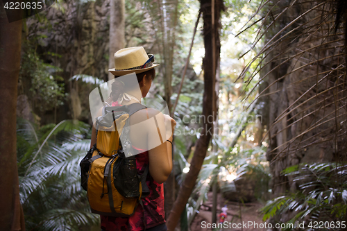 Image of Woman in hat with backpacks