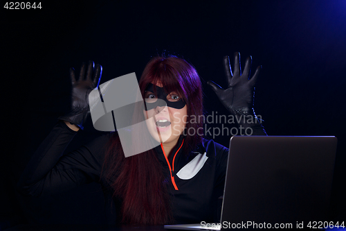 Image of Brunette spy in black mask