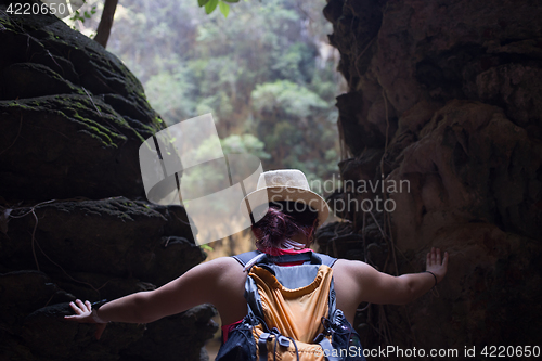 Image of Girl among hills in rainforest