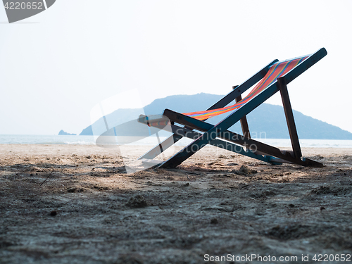 Image of Chaise lounge on sandy beach