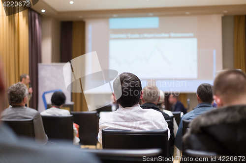 Image of Male speeker having talk at public event.