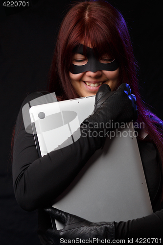 Image of Hacker in mask and gloves