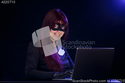 Image of Girl in mask at night