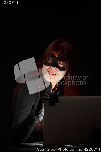 Image of Girl in mask with laptop