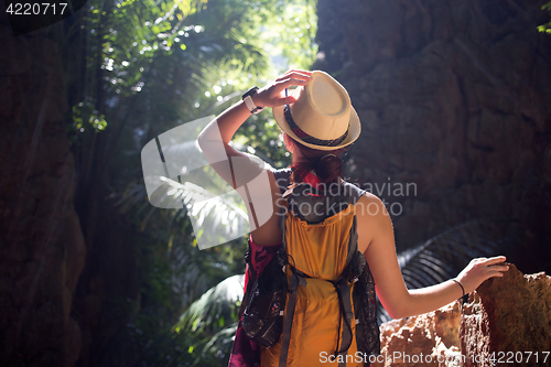 Image of Girl with hat in ravine