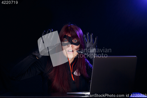 Image of Girl spy with raised hands