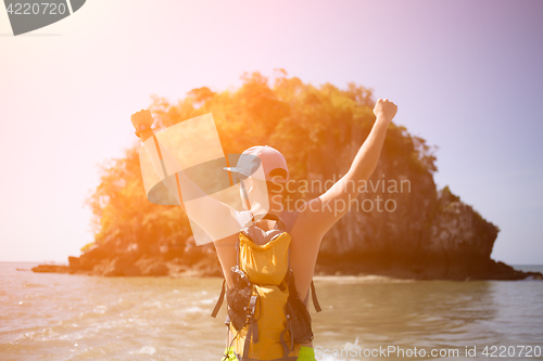 Image of Young guy with arms raised
