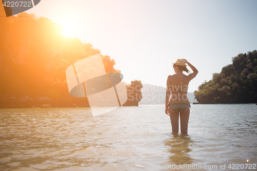 Image of Girl in swimsuit on seashore