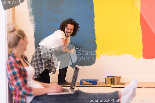 Image of Happy couple doing home renovations