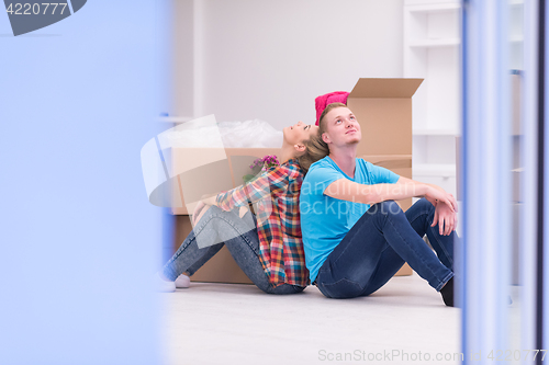 Image of young couple moving  in new house