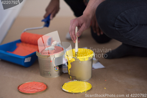 Image of painters prepare color for painting