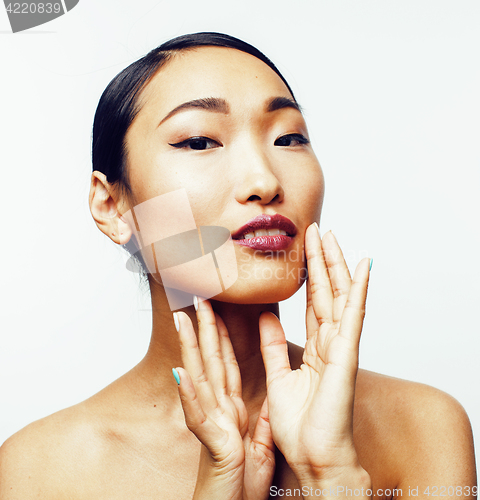 Image of young pretty asian woman with hands on face isolated on white background, stylish fashion healthcare people concept 