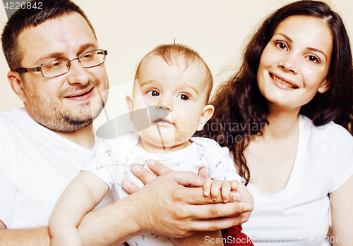 Image of young happy modern family smiling together at home. lifestyle real people concept, father holding baby son