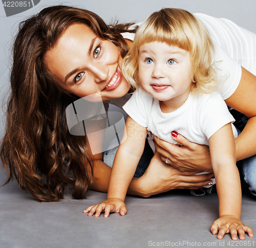 Image of mother with daughter together in bed smiling, happy family close up, lifestyle people concept, cool real modern family