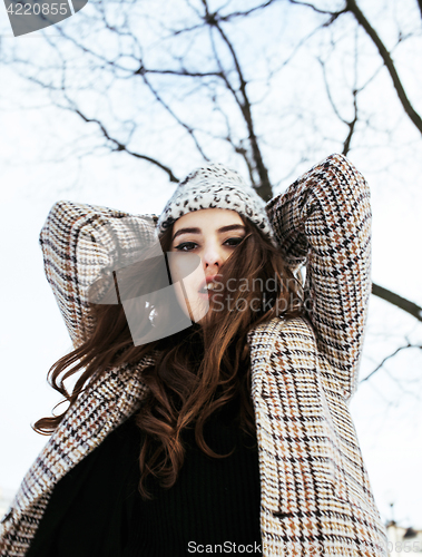 Image of young pretty stylish teenage girl outside on city street fancy fashion dressed drinking milk shake, lifestyle people concept