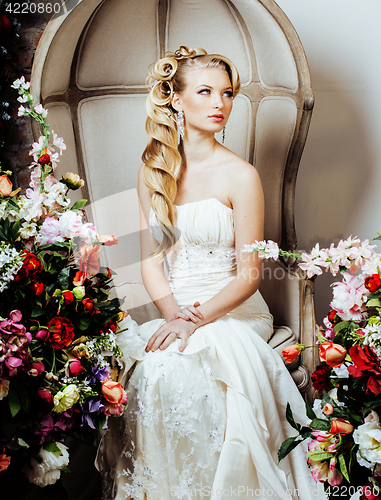 Image of beauty emotional blond bride in luxury interior dreaming, crazy complicate hairstyle